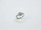 Side angle highlighting the sharp dimensional silhouette and rhythmic textured flow of a silver round ring.