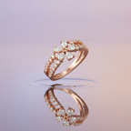 Side profile view displaying the dimensional tiered silhouette and organic curvature of a rose gold floral ring.