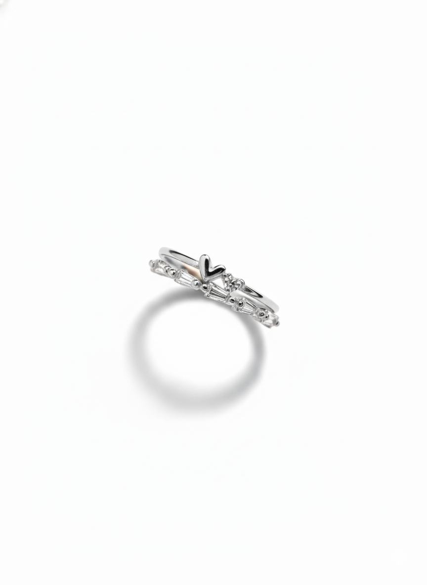 Side profile showcasing the multi-dimensional tiered architecture and modular silver-toned bands of a silver heart ring.