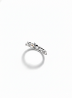 Side profile showcasing the multi-dimensional tiered architecture and modular silver-toned bands of a silver heart ring.