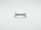 Real-world perspective showing a dual-line silver crossover ring
