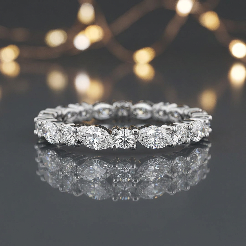 Polished sterling silver band showcasing an alternating sequence of marquise and round diamonds in a sharp silhouette.