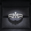 A White gold statement ring designed as a celestial starburst flower cluster with a diamond pavé center.