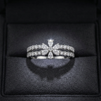 A White gold statement ring designed as a celestial starburst flower cluster with a diamond pavé center.
