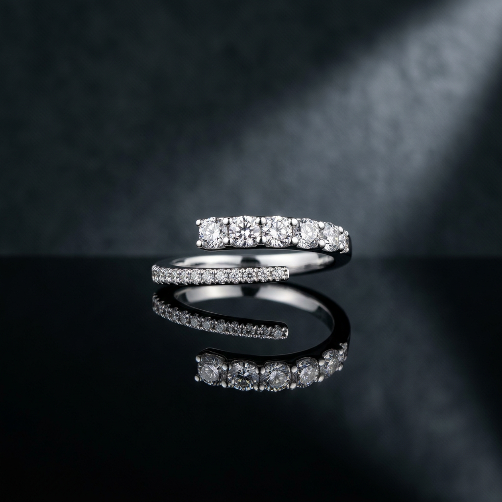 High-polish sterling silver bypass ring featuring a continuous stream of precision-set round diamonds.