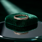 A unique variation of the gold wave ring, featuring a delicate line of pavé diamonds along its crest.