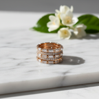 An architectural tiered statement ring featuring rhythmic rows of linear step cut stones and brilliant pave set lab grown diamonds forming a bold silhouette.