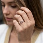 Macro photo showing the flawless alignment of three rows of micropavé diamonds set in gold prongs.
