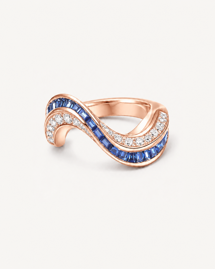 Blue Wave Ring in Rose Gold, low three-quarter pose on Oyster Silk background