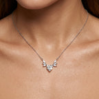 Close-up of a modern sterling silver necklace for women with an exquisite winged heart pendant