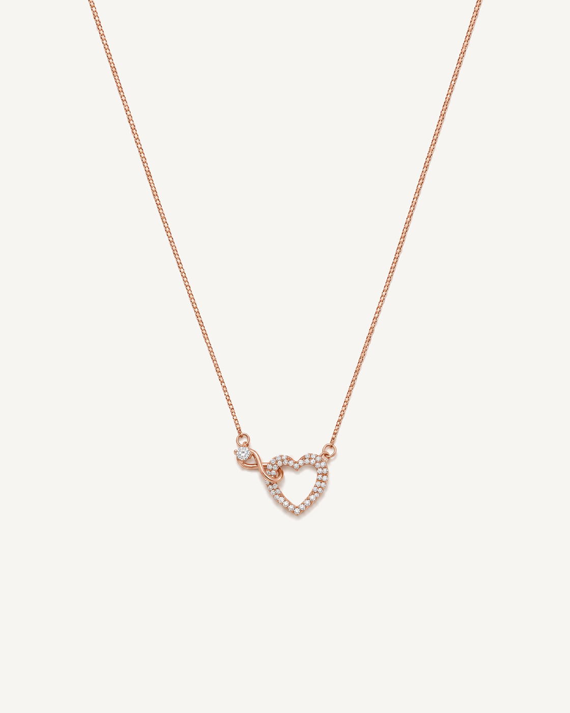 Rose gold infinity heart necklace with pavé diamonds and a round solitaire
