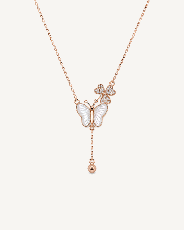 Butterfly Flight Necklace in rose gold on Oyster Silk background