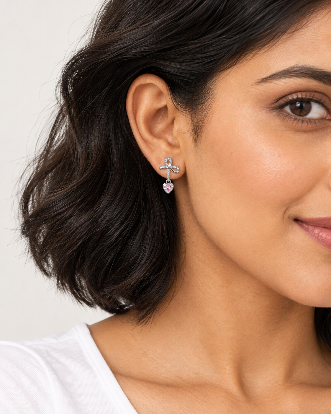 Bow Heart Drop Earrings — worn close view