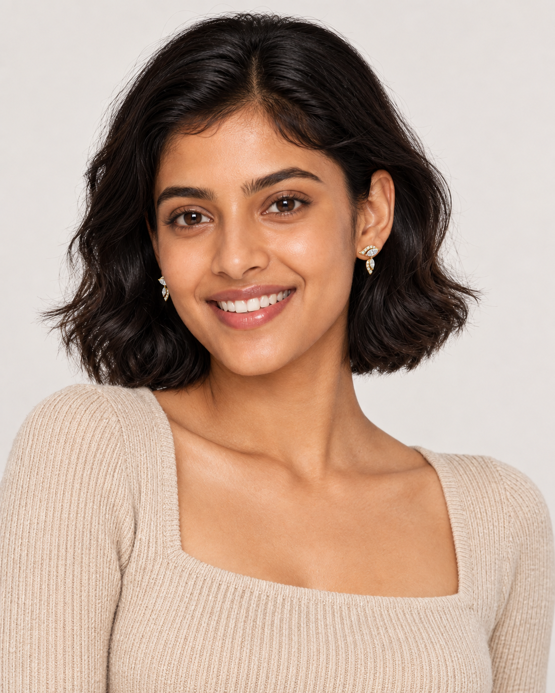 Curved Leaf Drop Earrings — worn studio view