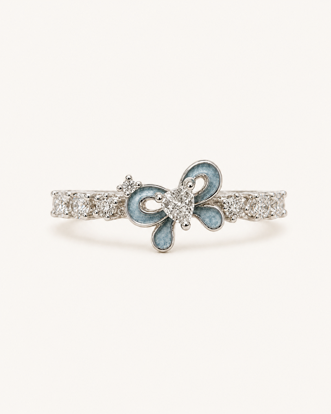 Silver bow ring with bluish-gray enamel and diamonds